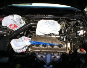 covering engine before cleaning